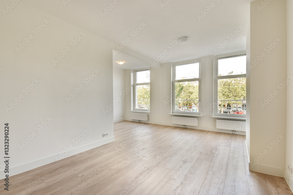 An inviting empty room featuring large windows that flood the space with natural light, showcasing clean lines and a fresh feel. An inviting empty room featuring large windows that flood the space with natural light, showcasing clean lines and a fresh feel.