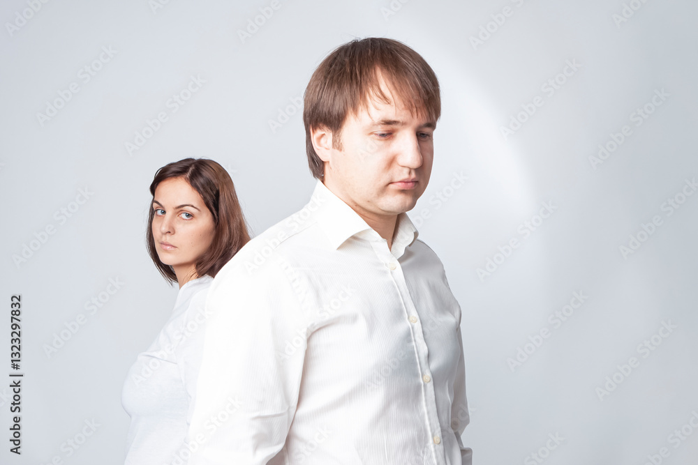 Relationships Concepts. Young Caucasian Couple Trying to Solve Relationships Problems While Standing Together Back to Back With Depression Relationships Concepts. Young Caucasian Couple Trying to Solve Relationships Problems While Standing Together Back to Back With Depression