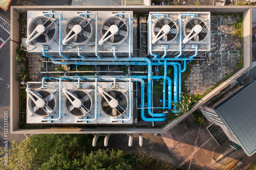 Aerial View of Rooftop Cooling System with Fans and Pipes