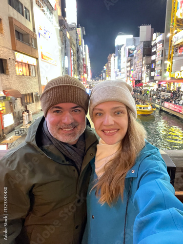 Couple selfie at Dotonbori, Osaka, Japan photo