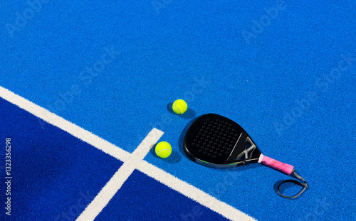Quadro em tela Yellow ball on floor behind paddle net in blue court outdoors