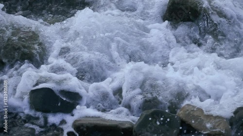 The powerful flow of water over the rocks
