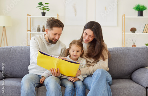 Loving and positive parents and little daughter enjoy a leisurely day at home, reading a book together. Bonding activity promotes learning, family unity, and precious moments of connection.