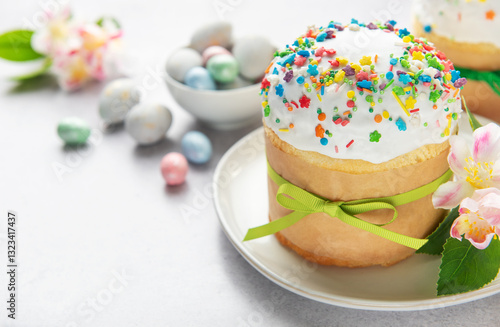 Obraz na płótnie Delicious easter cake decorated with colorful sprinkles and green ribbon w salonie