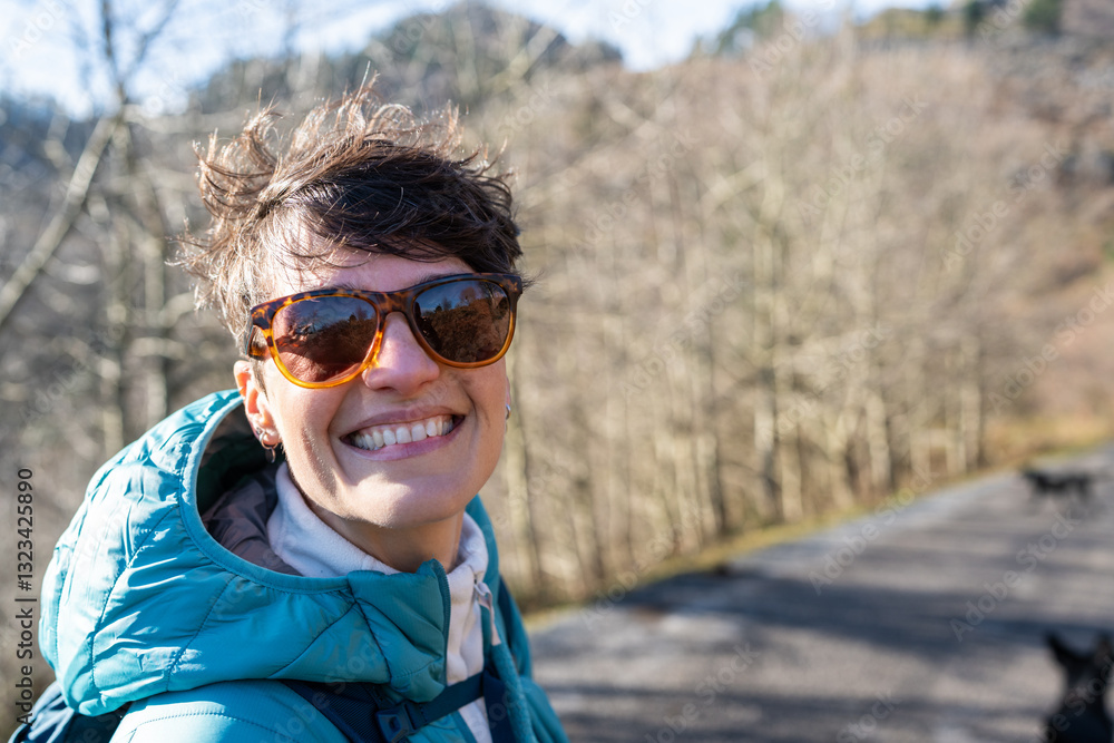 Smiling hiker enjoying sunny day in Spain mountains Smiling hiker enjoying sunny day in Spain mountains