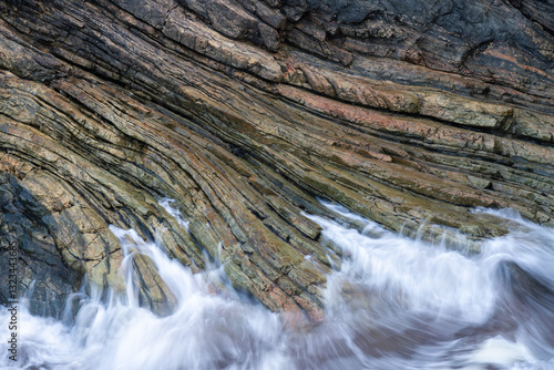 Textured Rock Formations by the Shore in Galicia