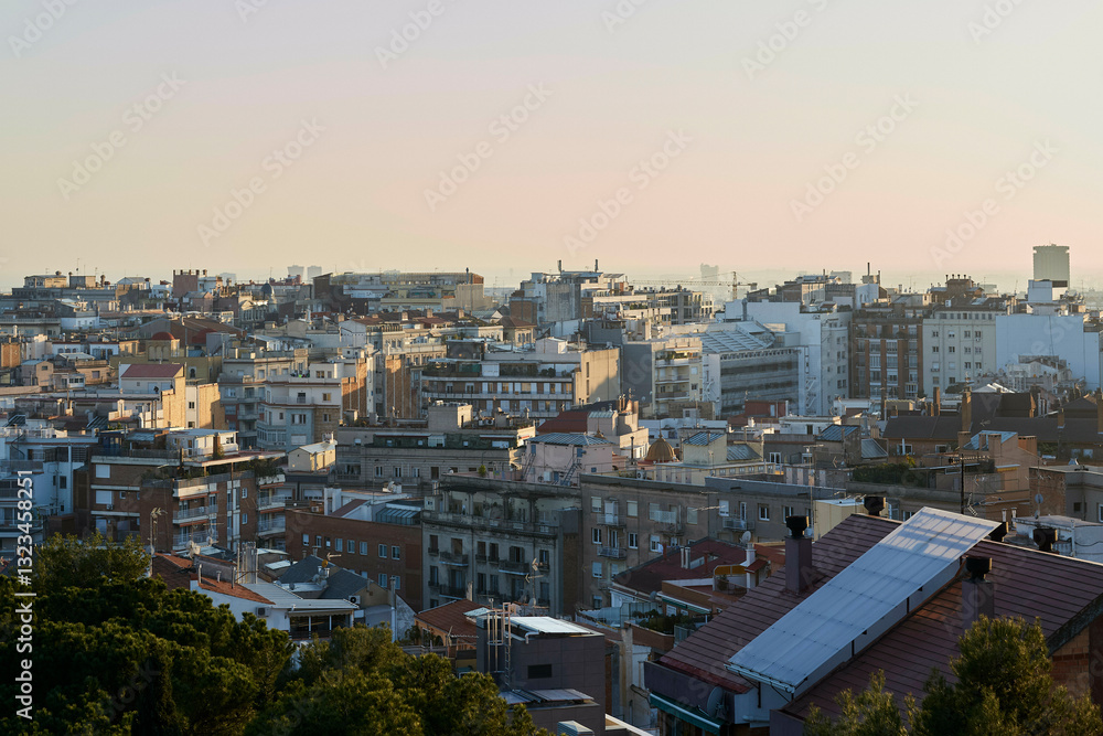 Urban cityscape with densely packed buildings under a soft evening sky. Barcelona, Spain Urban cityscape with densely packed buildings under a soft evening sky. Barcelona, Spain