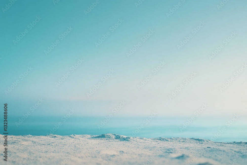 Fototapeta premium Serene snow landscape with a clear, pastel sky.