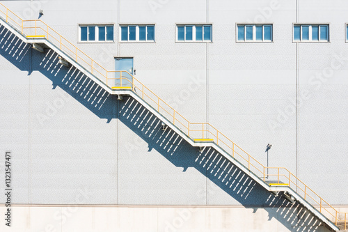 Industrial Staircase with Geometric Shadows on Building