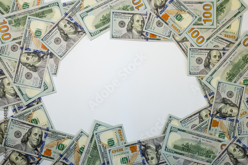 Stacks of hundred dollar bills arranged creatively on a flat surface for financial themes and marketing