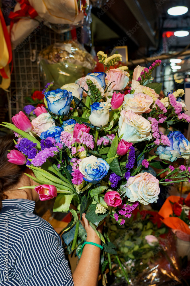 Woman holding a bouquet of roses Woman holding a bouquet of roses