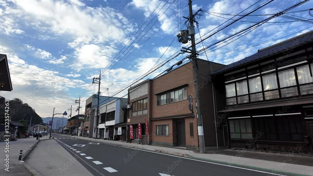 Deserted street with shops and houses under a cloudy sky near Amanohashidate Station, Kyoto, Japan Deserted street with shops and houses under a cloudy sky near Amanohashidate Station, Kyoto, Japan