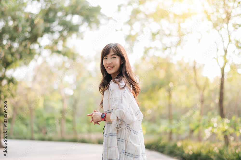 Asian woman enjoying summer outdoors, breathing fresh air with joyful smile, surrounded by lush greenery and sunlight Asian woman enjoying summer outdoors, breathing fresh air with joyful smile, surrounded by lush greenery and sunlight