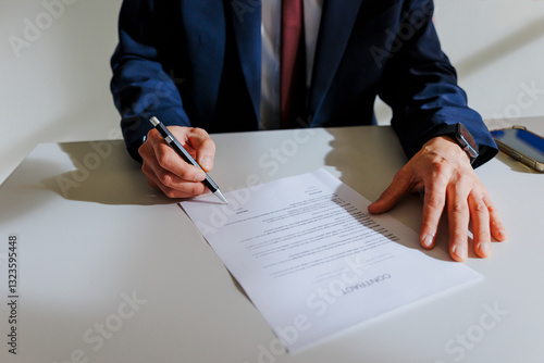 Business professional signing important contract document photo