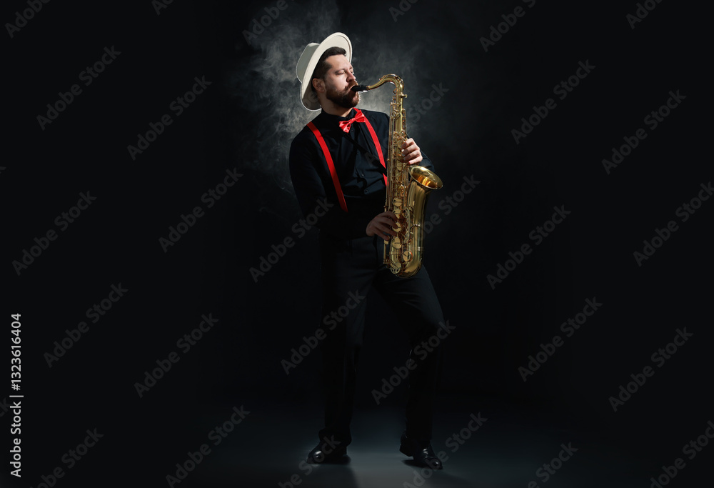 Naklejka premium Professional musician playing saxophone on black background with smoke