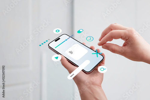 Quadro em tela Hand holding smartphone, assembling UI elements on screen, concept of mobile app