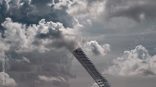 Culture and religion, states of mind concept. Stairs to heaven visualization. Abstract moving stairs going up to the cloudy sky