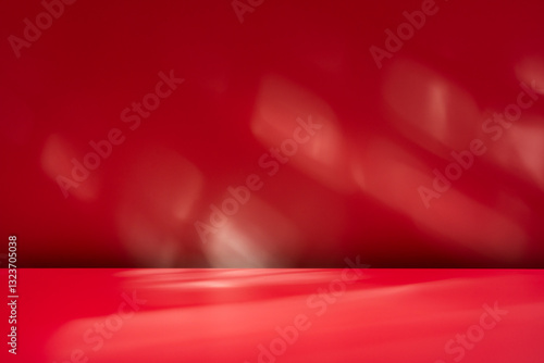Empty table on dark red wall background. Composition with abstract shadow on the wall and pink table. Mock up for presentation, branding products, cosmetics, food or jewelry.	
