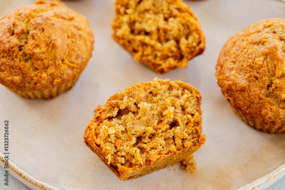 delicious carrot and pineapple muffins on a bright background close-up delicious carrot and pineapple muffins on a bright background close-up