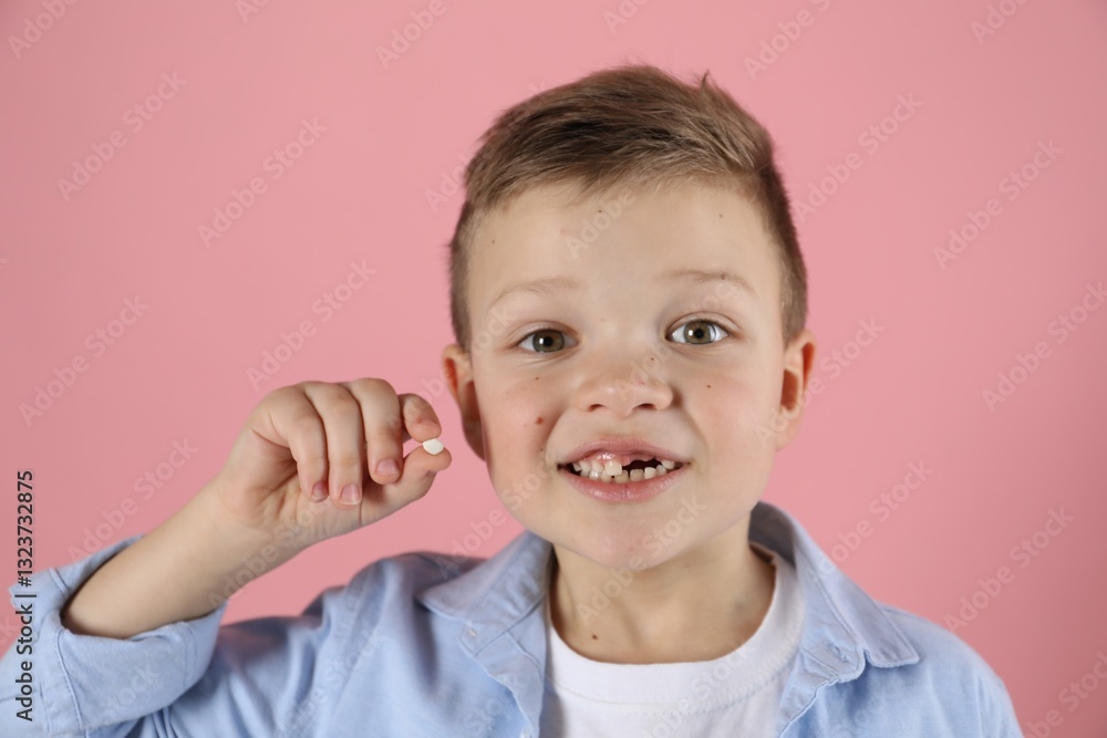 Cute little boy with missing tooth on pink background. Waiting for tooth fairy Cute little boy with missing tooth on pink background. Waiting for tooth fairy