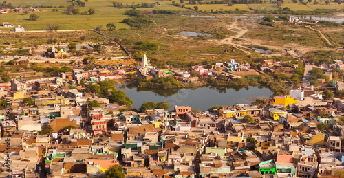 Fotografie drone shot of rural village view and lake , Nandagan, Uttar Pradesh