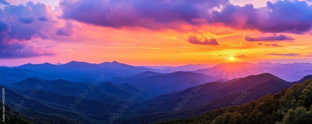 A vibrant sunset illuminates the mountain range with colorful shades A vibrant sunset illuminates the mountain range with colorful shades