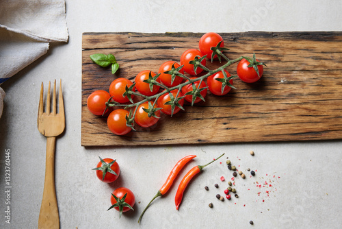 healthy tomatoes cherry branch. Top view on wooden table.