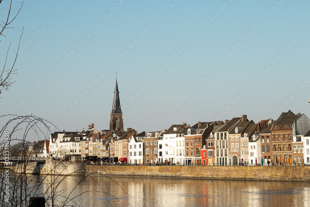 A scenic European city by the river with charming architecture and a canal flowing through, peaceful and picturesque atmosphere. A scenic European city by the river with charming architecture and a canal flowing through, peaceful and picturesque atmosphere.