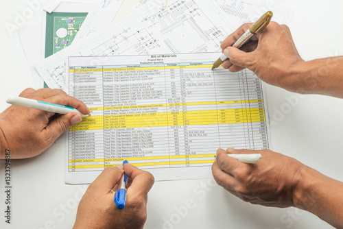 Bild auf Leinwand Engineer team assesses bill of material with detailed documentation and collabor