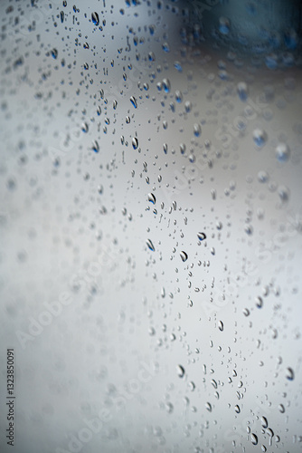 Obraz na płótnie Water rain drops on a glass window, with shallow depth of field. w salonie