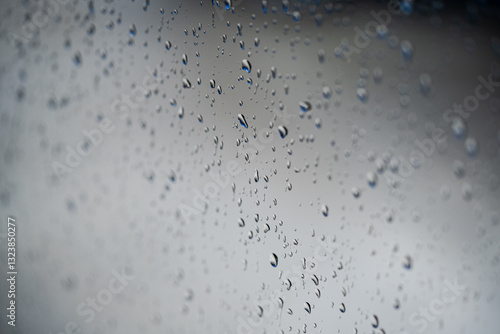 Obraz na płótnie Water rain drops on a glass window, with shallow depth of field. w salonie