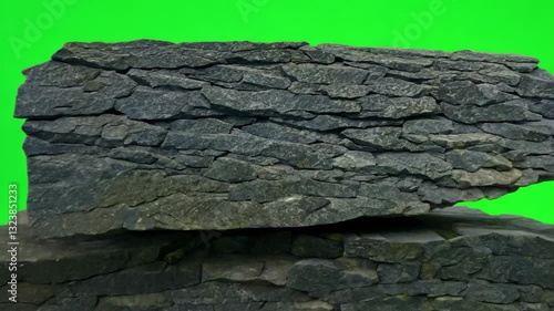 Stacked stones with a vibrant green background, showcasing natural texture and color.