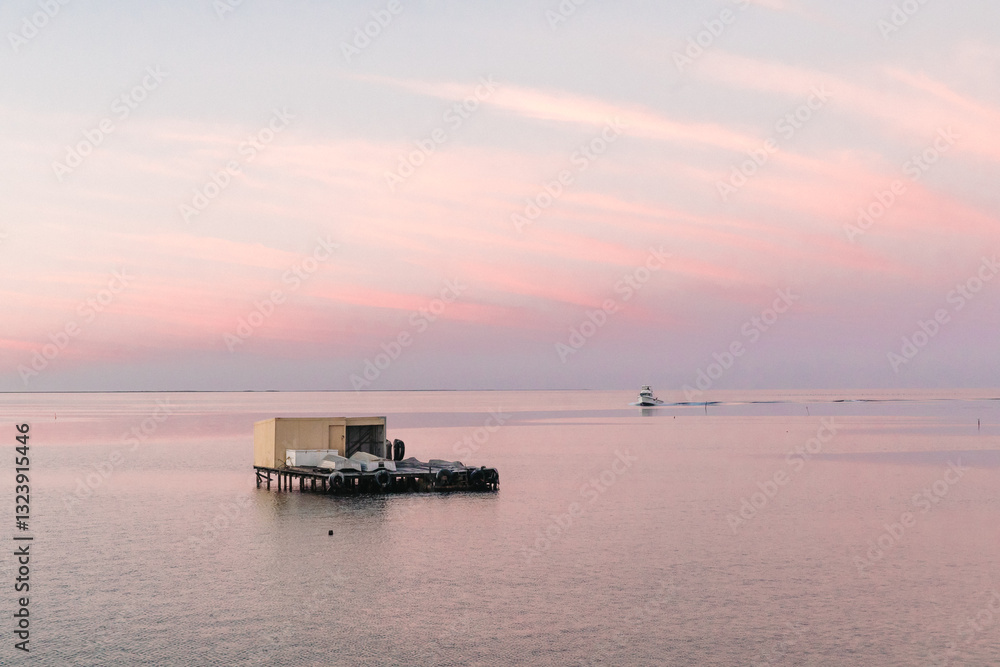 Horizontal shot of a crayfishing boat at sunrise with shack Horizontal shot of a crayfishing boat at sunrise with shack