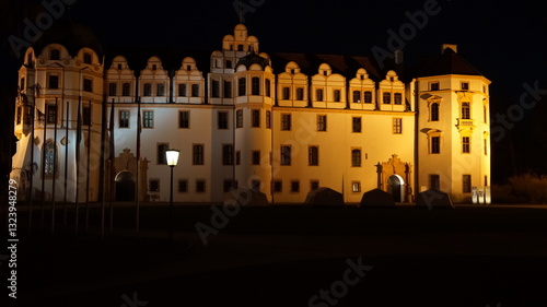 ancient castle in the evening light of city lanterns