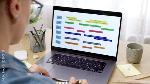 Woman looking at screen with calendar and dates. Concept of planning business meetings and events. Organization of time management.