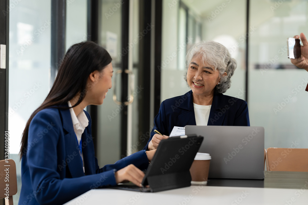 Asian business team working with analytical reports and consultants showing plans, financial analysis Asian business team working with analytical reports and consultants showing plans, financial analysis