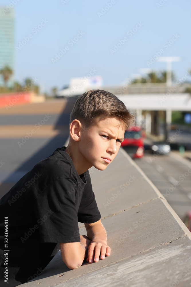 Fototapeta premium Handsome teenager standing with skateboard. Adolescent discovers city streets