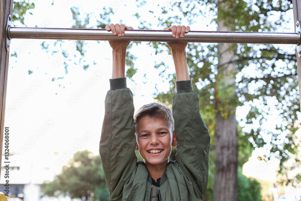 Handsome teenager doing exercises outdoors Handsome teenager doing exercises outdoors