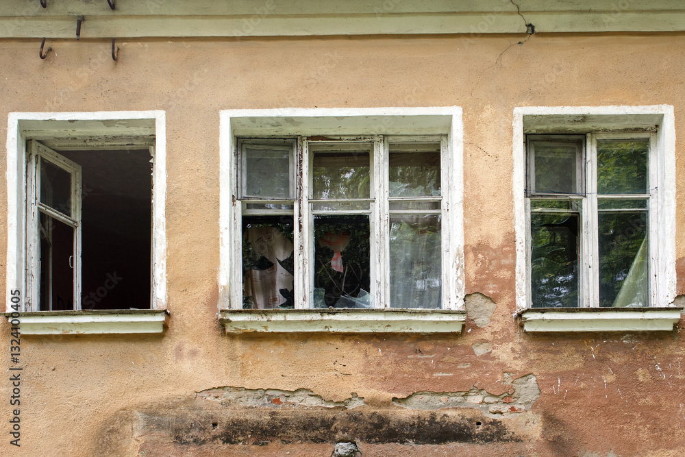 broken windows in old abandoned house