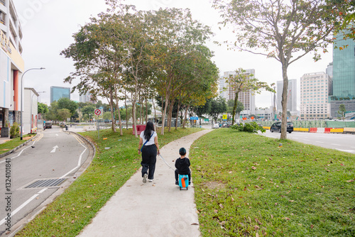 Woman and kids walking in the park