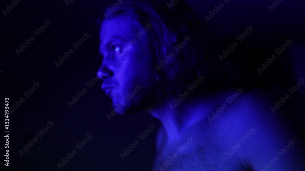 man in neon light at night at work place at home eating man in neon light at night at work place at home eating