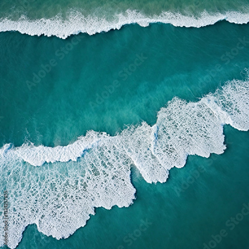 Aerial view beautiful of sea waves from drone. Stock image of blue color of ocean water, sea surface. Top view on turquoise waves, clear water surface texture.