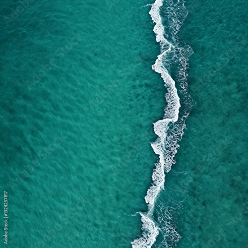 Aerial view beautiful of sea waves from drone. Stock image of blue color of ocean water, sea surface. Top view on turquoise waves, clear water surface texture.