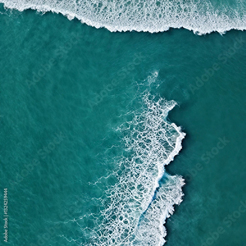Aerial view beautiful of sea waves from drone. Stock image of blue color of ocean water, sea surface. Top view on turquoise waves, clear water surface texture.