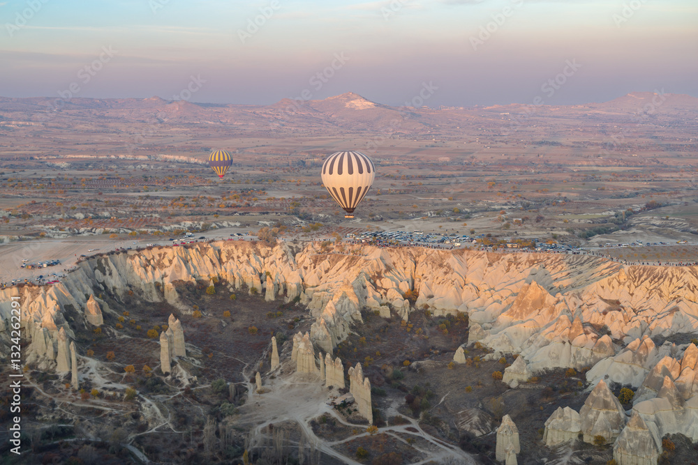 Hot air balloons flying above rock formations, Goreme National Park, Goreme, Cappadocia, Anatolia, Turkey