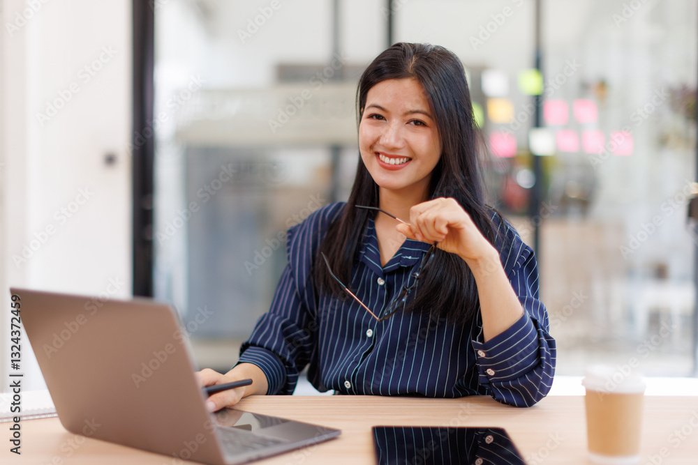 Asian businesswoman sits at desk with laptop online using internet and notepad happily recording receipt contact information online delivery.
Asian businesswoman sits at desk with laptop online using internet and notepad happily recording receipt contact information online delivery.