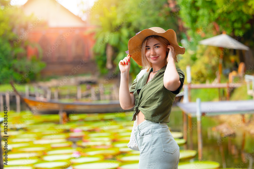 Fototapeta premium Happy pretty Young caucasian woman enjoying nature in phuket, thailand