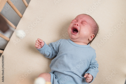 Obraz na płótnie Tired newborn crying in cozy nursery w salonie