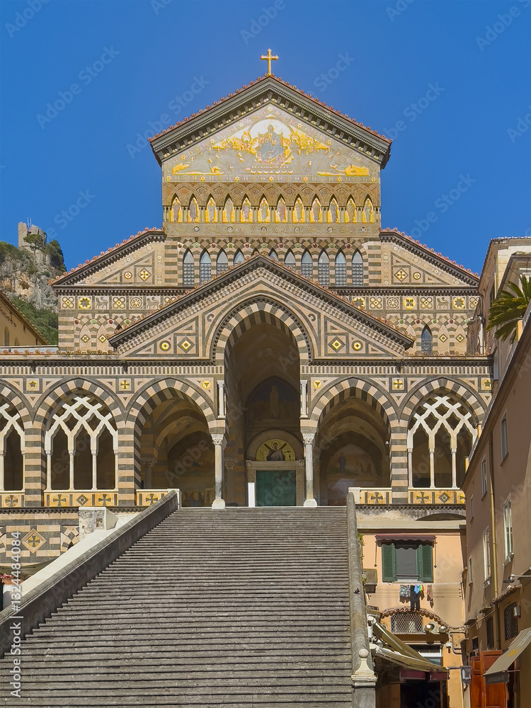 Amalfi, Salerno, Italy - July 6, 2024: Cathedral of St Andrew Apostle front facade with long stairway leading to entrance. Amalfi, Salerno, Italy - July 6, 2024: Cathedral of St Andrew Apostle front facade with long stairway leading to entrance.