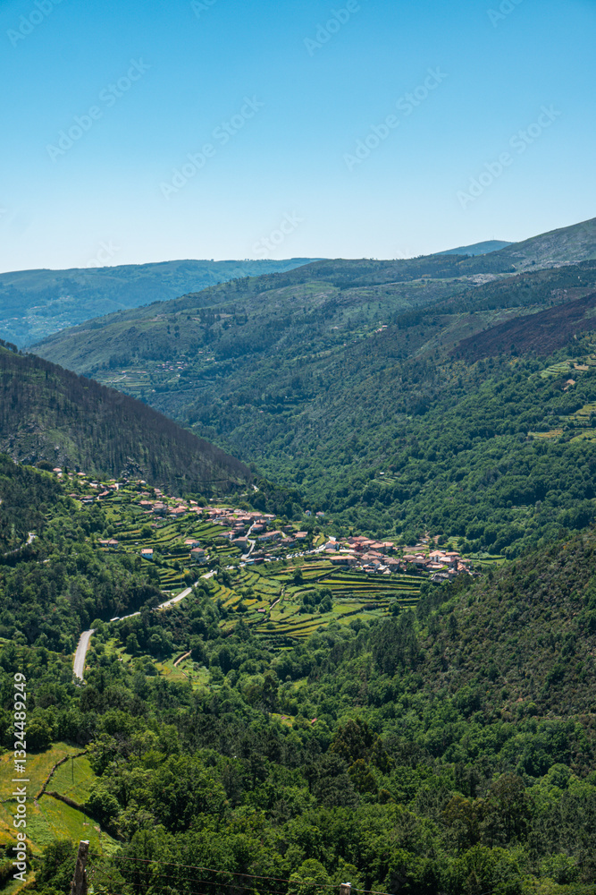The picturesque village of Sistelo, nestled amidst the terraced hills of the Peneda-Gerês National Park, offers stunning views of the rural Portuguese landscape. The picturesque village of Sistelo, nestled amidst the terraced hills of the Peneda-Gerês National Park, offers stunning views of the rural Portuguese landscape.